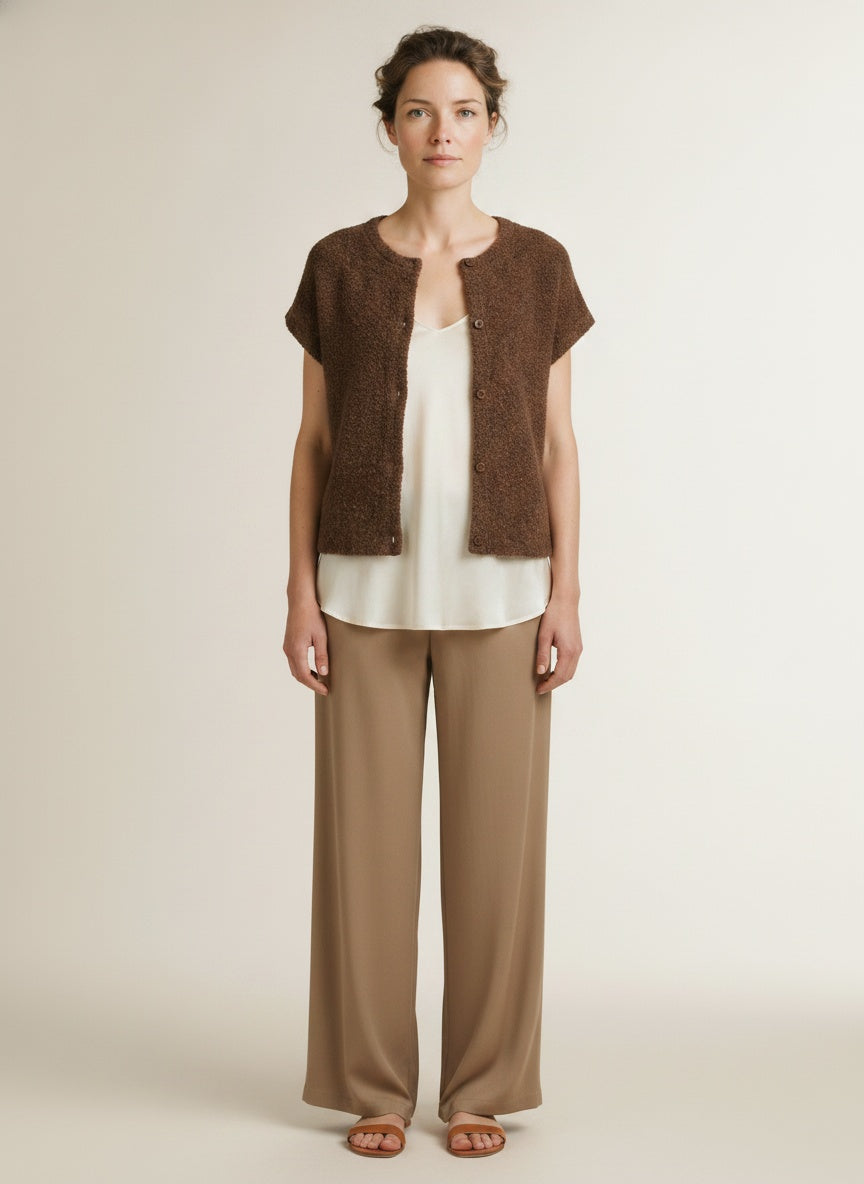 Full body view of the model wearing Red Button Sleeveless Knit Boucle Mud