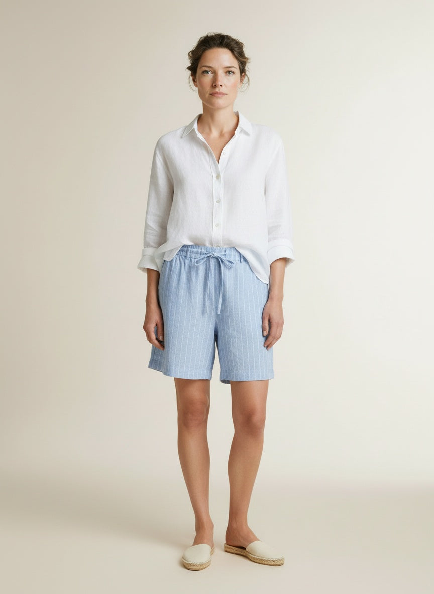 Full body view of the model wearing Red Button Cami Short Linen/visco Pinstripe Light Blue