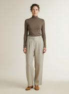 Full body view of the model wearing Haute L'amitiÉ Lux Turtle Ls Tee Walnut Melange
