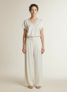 Full body view of the model wearing Co'couture Iduncc Lace Ss Blouse Off White
