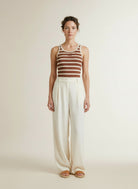 Full body view of the model wearing Co'couture Grannycc Rib Emb. Tank Top Offwhite/suntan