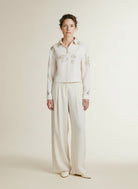 Full body view of the model wearing Nukus Adora Blouse Paillets 17 Off White