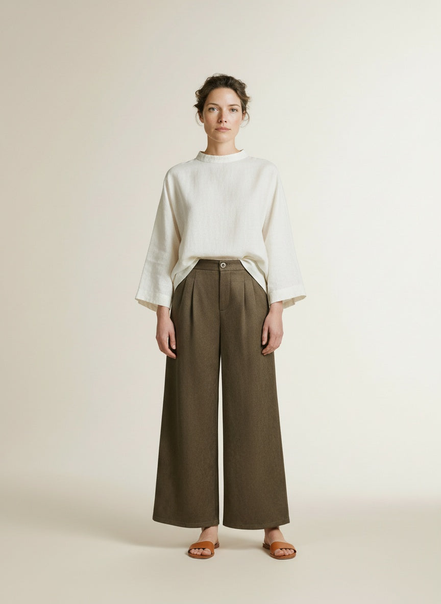 Full body view of the model wearing Nukus Bodine Pants Suede 319 Moss