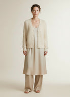 Full body view of the model wearing Red Button Cardigan Fuzzy Cream
